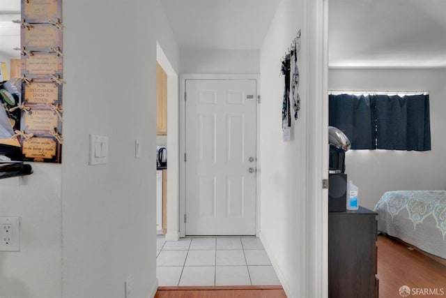 hallway with light tile patterned floors