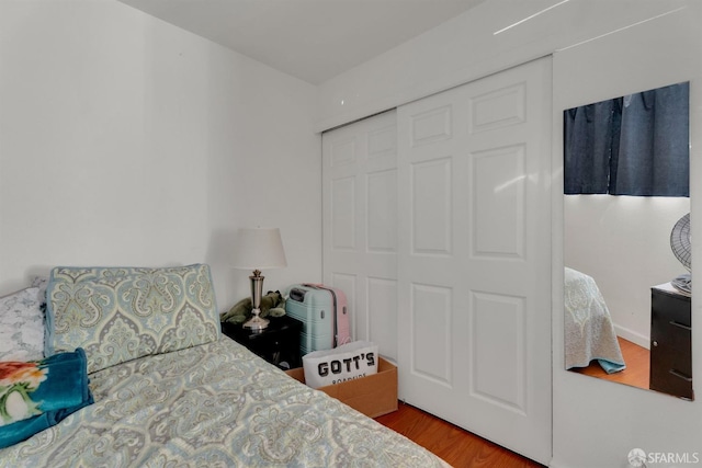 bedroom featuring a closet and hardwood / wood-style floors