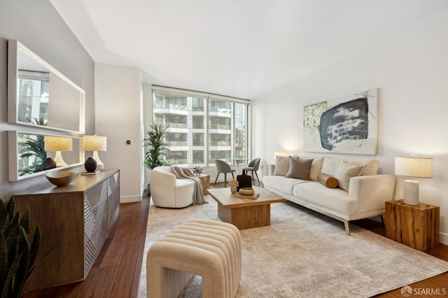 living room featuring a healthy amount of sunlight and hardwood / wood-style floors