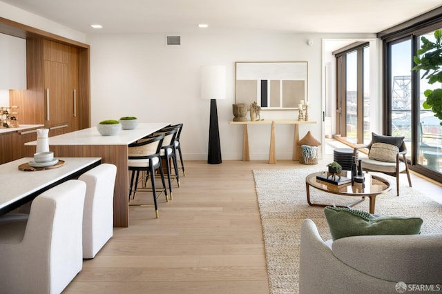 living room featuring light hardwood / wood-style flooring and expansive windows