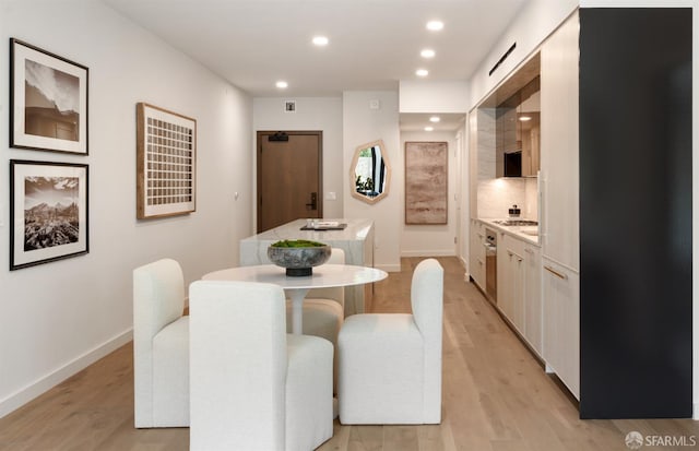 dining room featuring light hardwood / wood-style floors