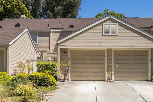 2536 Treeside Way, Richmond, CA 94806 - view of front of property featuring concrete driveway, roof with shingles, and an attached garage