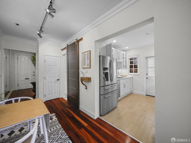1624 Vallejo St Unit 2, San Francisco, CA 94123 - corridor with a barn door, light wood-style flooring, ornamental molding, recessed lighting, and rail lighting