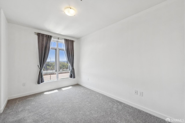 423 7th St Unit 303, Oakland, CA 94607 - unfurnished room with baseboards and carpet floors