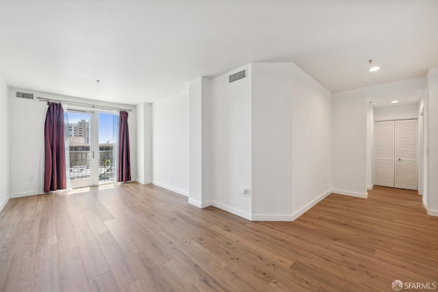 423 7th St Unit 303, Oakland, CA 94607 - spare room with wood finished floors and recessed lighting