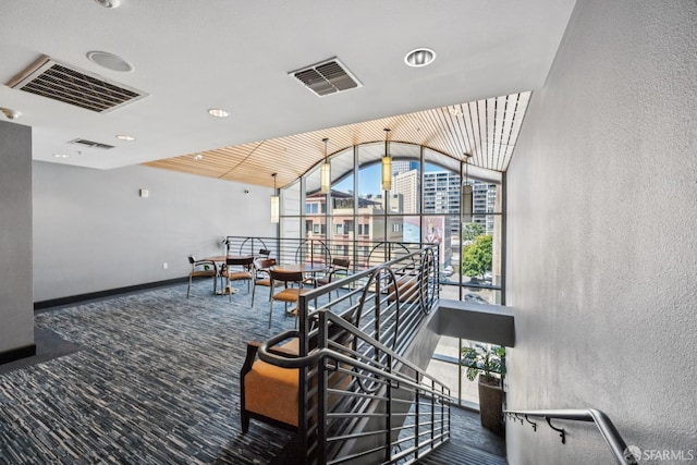 423 7th St Unit 303, Oakland, CA 94607 - building lobby with a textured wall, vaulted ceiling, and a wall of windows