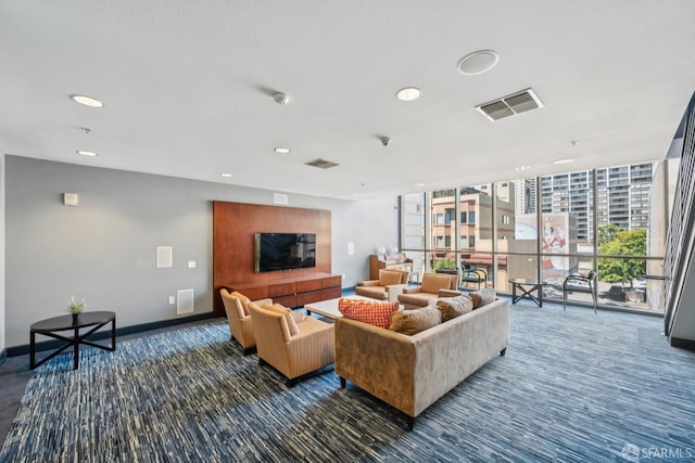 423 7th St Unit 303, Oakland, CA 94607 - carpeted living area featuring recessed lighting, a glass covered fireplace, and a wall of windows