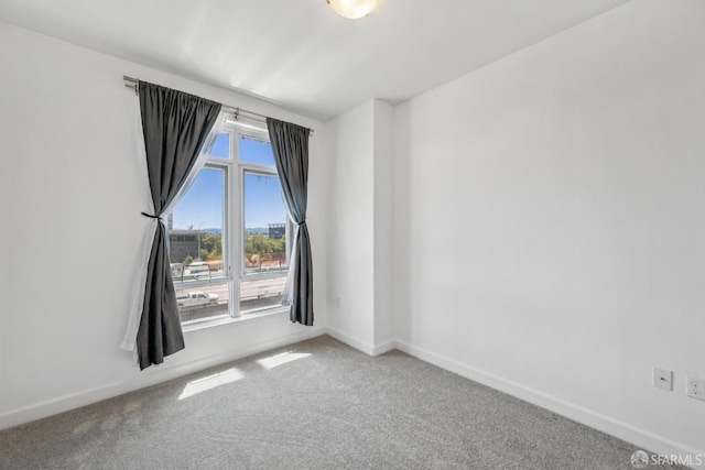 423 7th St Unit 303, Oakland, CA 94607 - spare room featuring carpet flooring and baseboards