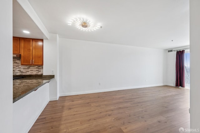 423 7th St Unit 303, Oakland, CA 94607 - unfurnished living room with light wood finished floors and recessed lighting
