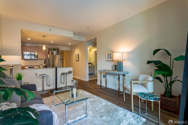 55 Page St Unit 428, San Francisco, CA 94102 - living area with dark wood-type flooring, baseboards, and recessed lighting