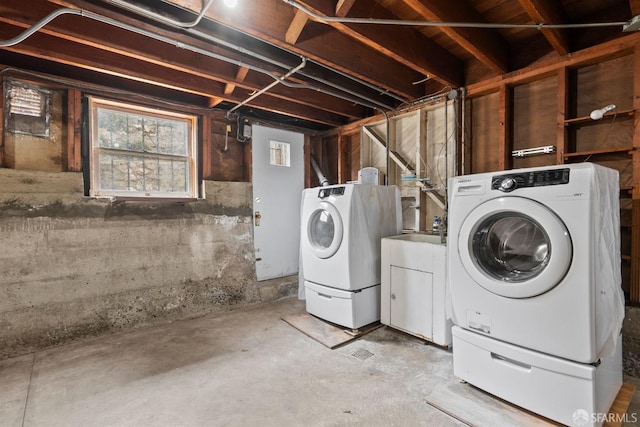laundry room featuring washing machine and clothes dryer