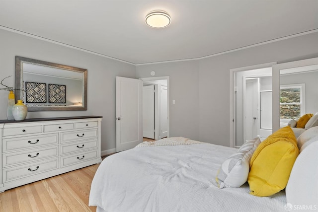 bedroom featuring light wood finished floors