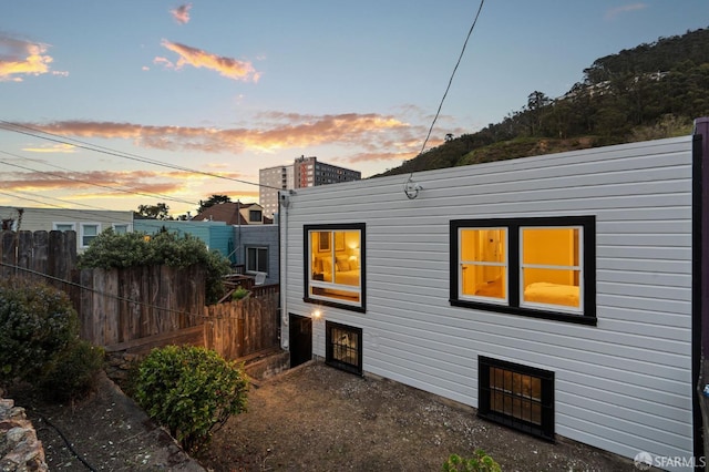 back of house featuring fence