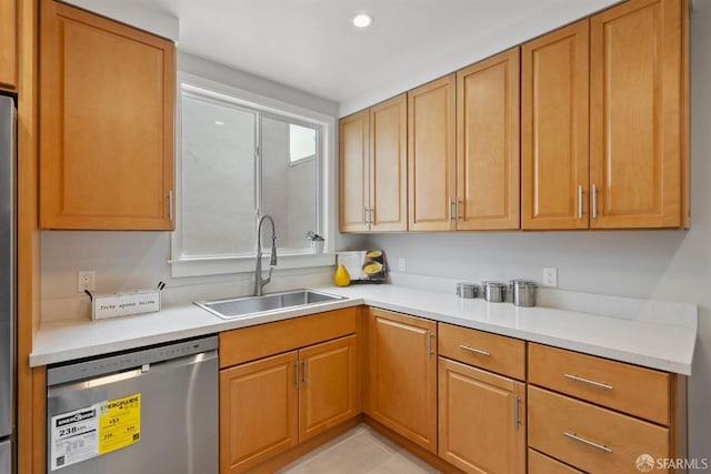 kitchen featuring dishwasher, a sink, light countertops, recessed lighting, and light tile patterned flooring
