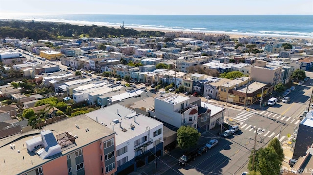 bird's eye view featuring a water view and a view of the beach