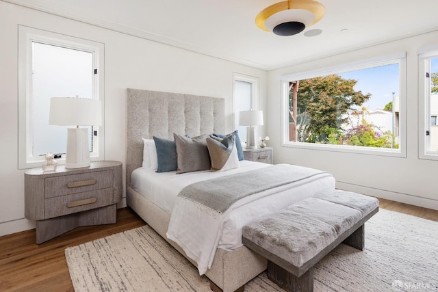 bedroom with hardwood / wood-style flooring