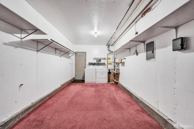 basement featuring separate washer and dryer, electric panel, and dark colored carpet