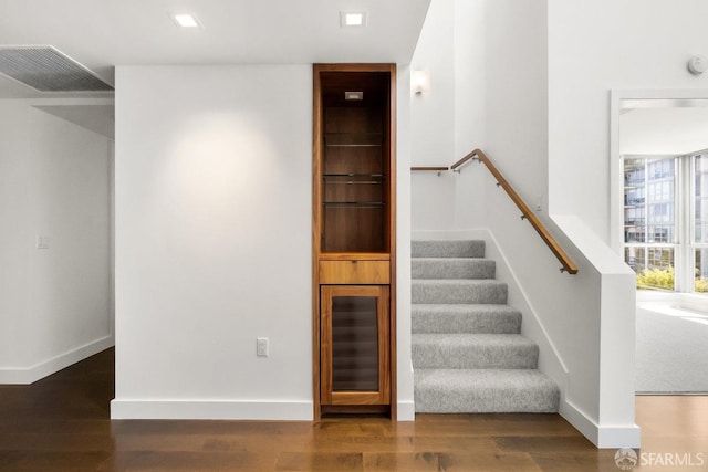 stairs with wood-type flooring