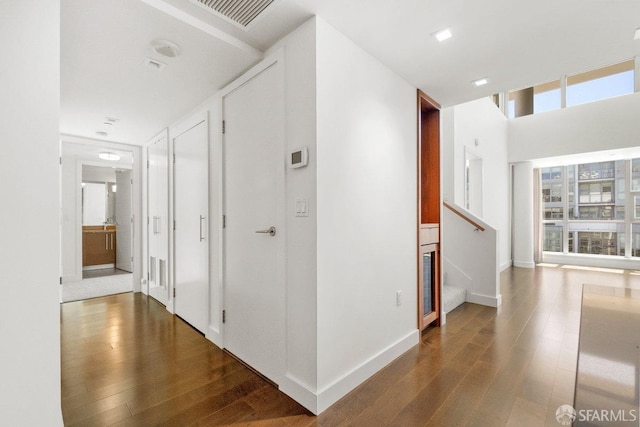 hallway featuring dark hardwood / wood-style floors