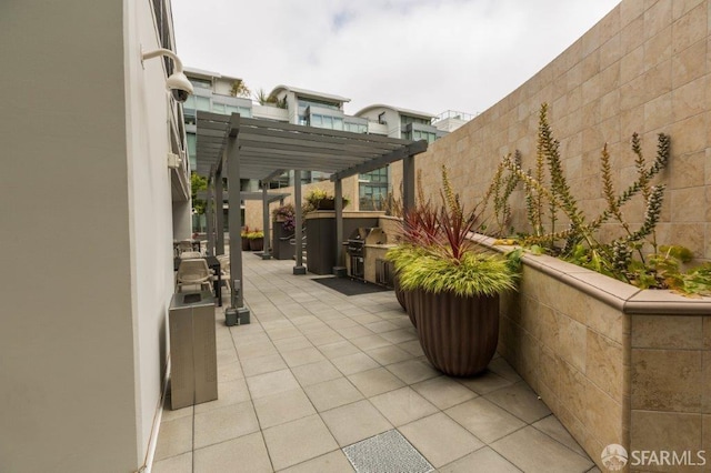 view of patio featuring a pergola and a jacuzzi