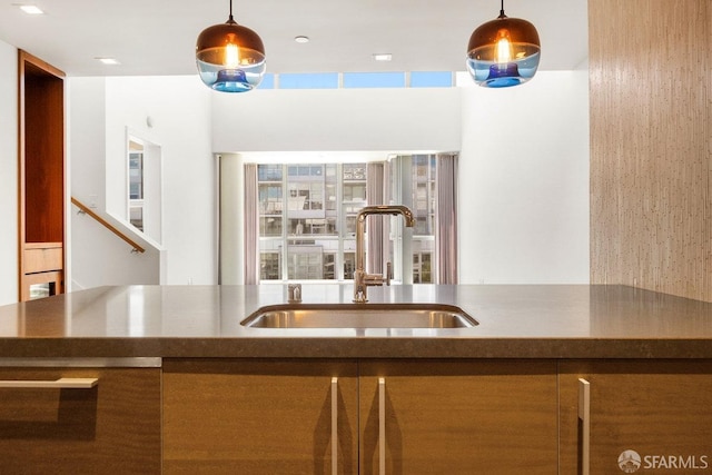 kitchen featuring decorative light fixtures and sink