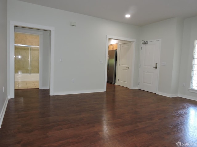 empty room with dark hardwood / wood-style floors