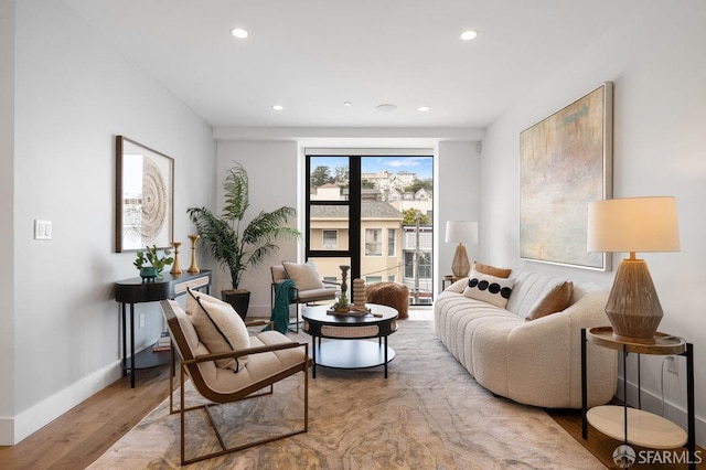 interior space with recessed lighting, baseboards, and wood finished floors