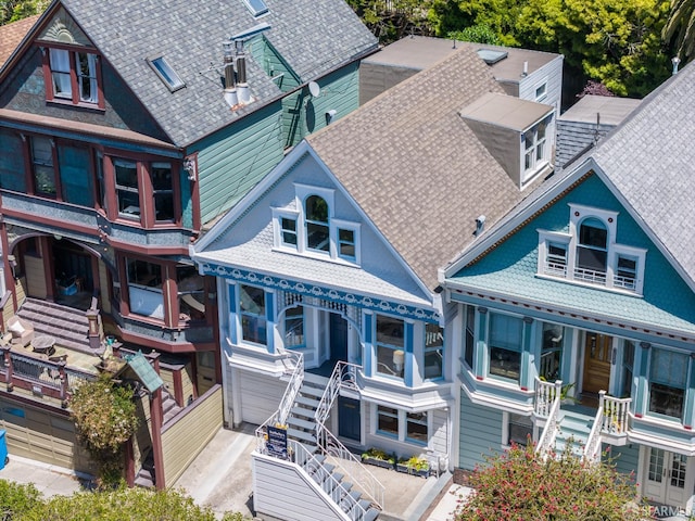 view of front of house featuring stairs and an attached garage