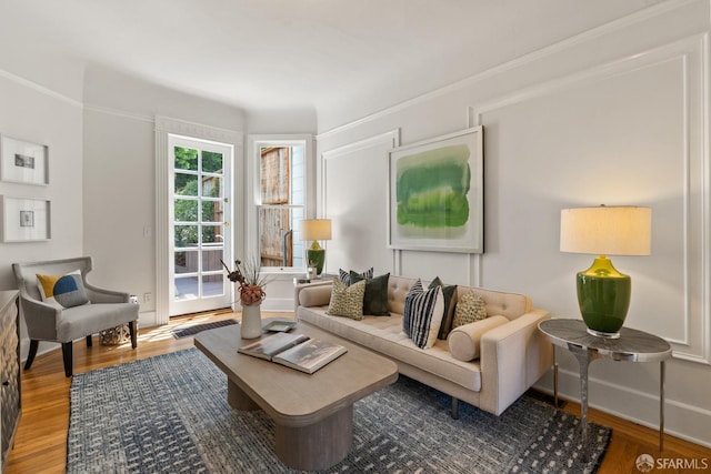 living area with wood finished floors and baseboards