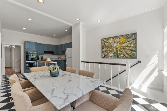 dining space with recessed lighting, tile patterned floors, ornamental molding, and baseboards