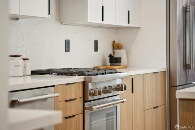 1029 Jackson St Unit 1031, San Francisco, CA 94133 - kitchen featuring high end appliances, light countertops, modern cabinets, and white cabinetry
