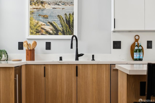 1029 Jackson St Unit 1031, San Francisco, CA 94133 - detailed view of light countertops, white cabinets, and a sink