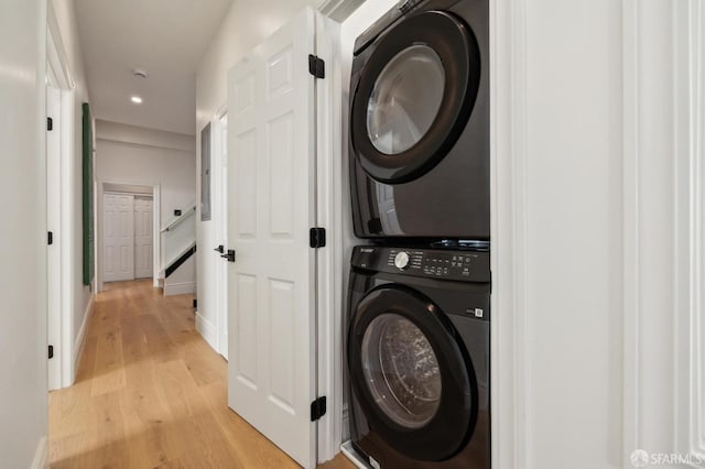 1029 Jackson St Unit 1031, San Francisco, CA 94133 - laundry area with stacked washer and clothes dryer, light wood-style floors, recessed lighting, and baseboards