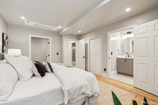 1029 Jackson St Unit 1031, San Francisco, CA 94133 - bedroom featuring light wood finished floors, recessed lighting, ensuite bathroom, baseboards, and a closet