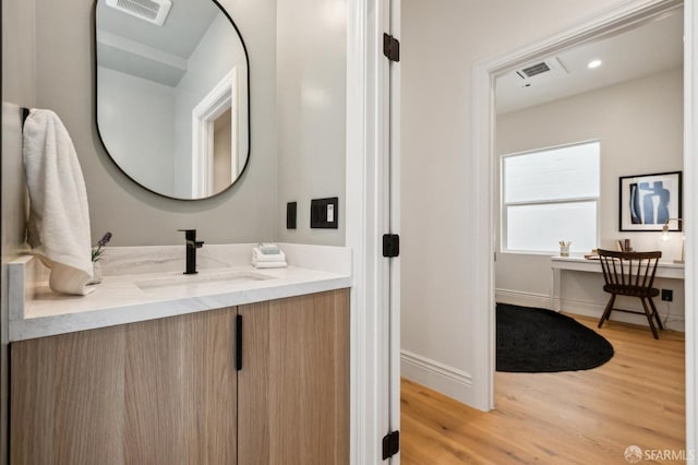 1029 Jackson St Unit 1031, San Francisco, CA 94133 - bathroom with vanity, wood finished floors, and baseboards
