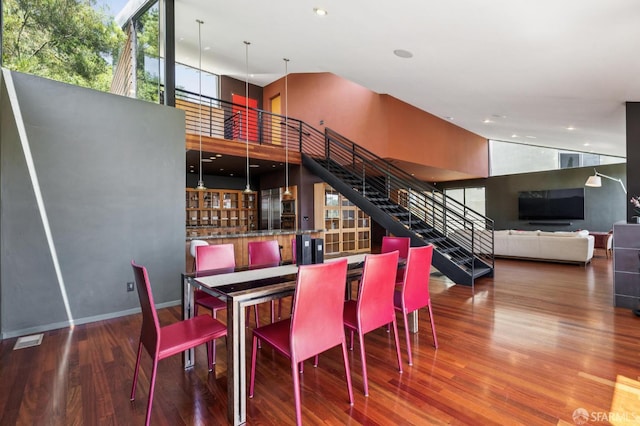 6353 Skyline Blvd, Oakland, CA 94611 - dining area with stairway, wood finished floors, a towering ceiling, and recessed lighting