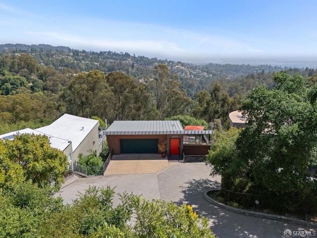 6353 Skyline Blvd, Oakland, CA 94611 - aerial view of property and surrounding area with a heavily wooded area