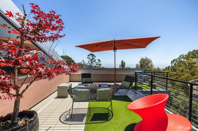 6353 Skyline Blvd, Oakland, CA 94611 - view of patio / terrace featuring a balcony and an outdoor living space with a fire pit