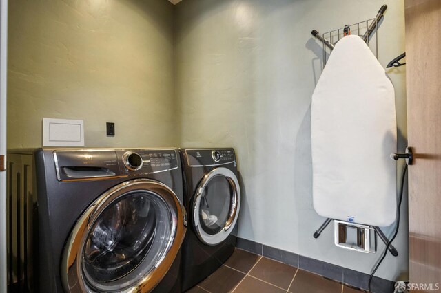 6353 Skyline Blvd, Oakland, CA 94611 - laundry room featuring independent washer and dryer and dark tile patterned floors