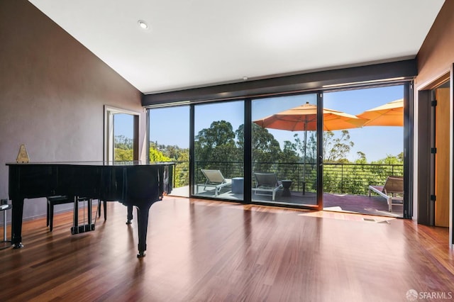 6353 Skyline Blvd, Oakland, CA 94611 - sitting room with wood finished floors, expansive windows, lofted ceiling, and recessed lighting