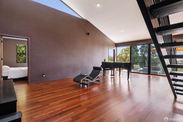 6353 Skyline Blvd, Oakland, CA 94611 - living area with high vaulted ceiling, healthy amount of natural light, wood finished floors, and recessed lighting