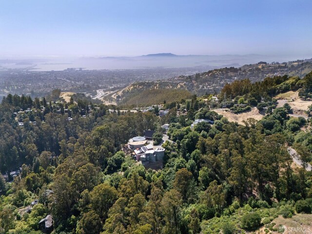 6353 Skyline Blvd, Oakland, CA 94611 - aerial view of property and surrounding area with a heavily wooded area and a mountain backdrop