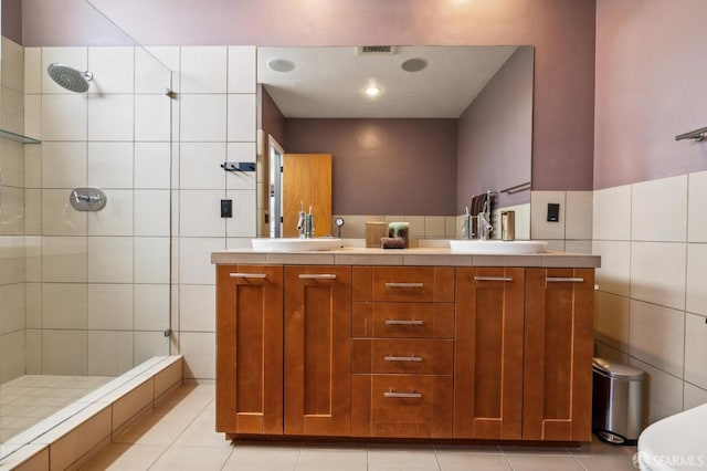 6353 Skyline Blvd, Oakland, CA 94611 - full bathroom featuring tile walls, a shower stall, double vanity, and tile patterned flooring