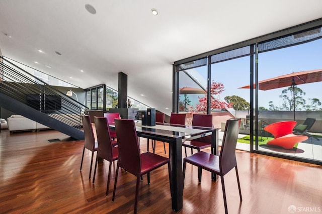 6353 Skyline Blvd, Oakland, CA 94611 - dining space with wood finished floors, stairs, and floor to ceiling windows
