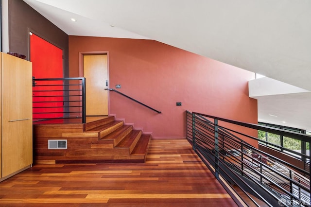 6353 Skyline Blvd, Oakland, CA 94611 - stairs with wood finished floors, recessed lighting, and vaulted ceiling