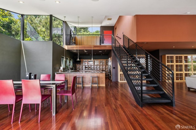 6353 Skyline Blvd, Oakland, CA 94611 - dining area with a towering ceiling, wood finished floors, stairs, recessed lighting, and plenty of natural light
