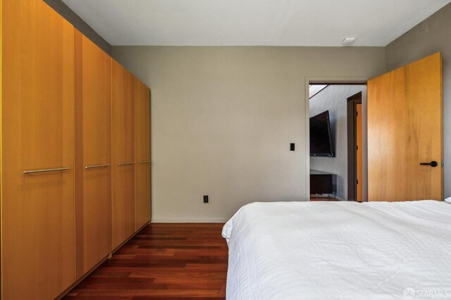 6353 Skyline Blvd, Oakland, CA 94611 - bedroom with dark wood-style floors and baseboards