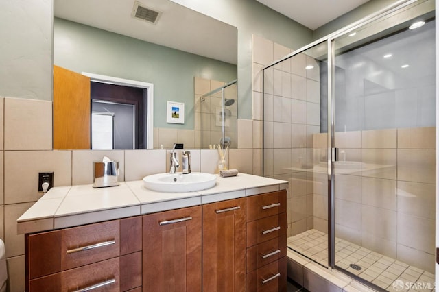 6353 Skyline Blvd, Oakland, CA 94611 - bathroom with vanity, a stall shower, and recessed lighting
