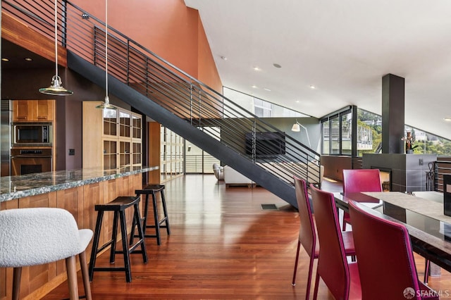 6353 Skyline Blvd, Oakland, CA 94611 - dining area featuring stairs, wood finished floors, and recessed lighting