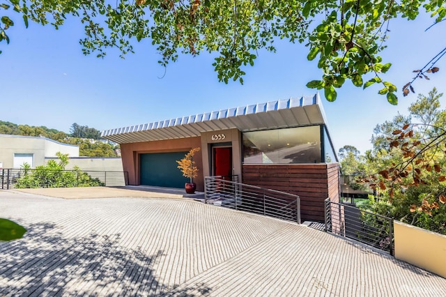 6353 Skyline Blvd, Oakland, CA 94611 - view of front of house featuring an attached garage and decorative driveway